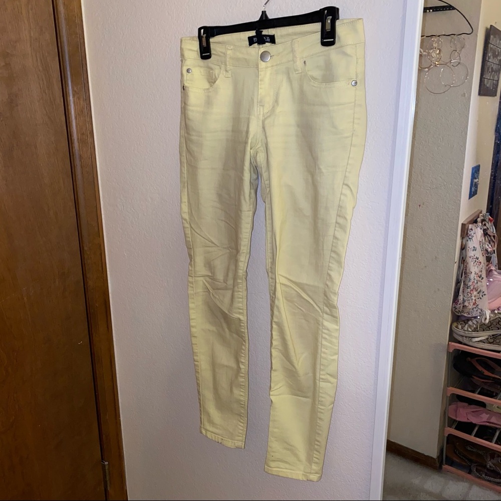 Pastel yellow skinny jeans